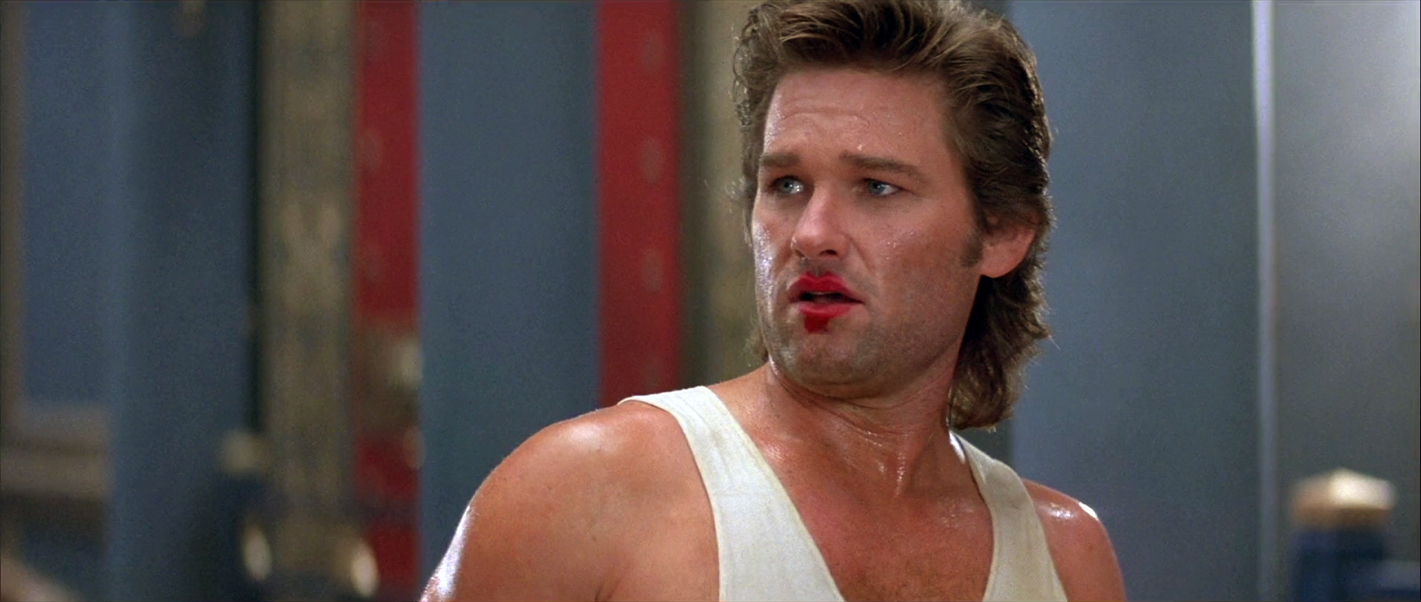 Fotograma de la película Golpe en la pequeña China. El actor Kurt Russel luce un corte de pelo Mullet caracterísitico de los 80 Fotograma de la película Golpe en la pequeña China. El actor Kurt Russel luce un corte de pelo Mullet caracterísitico de los 80